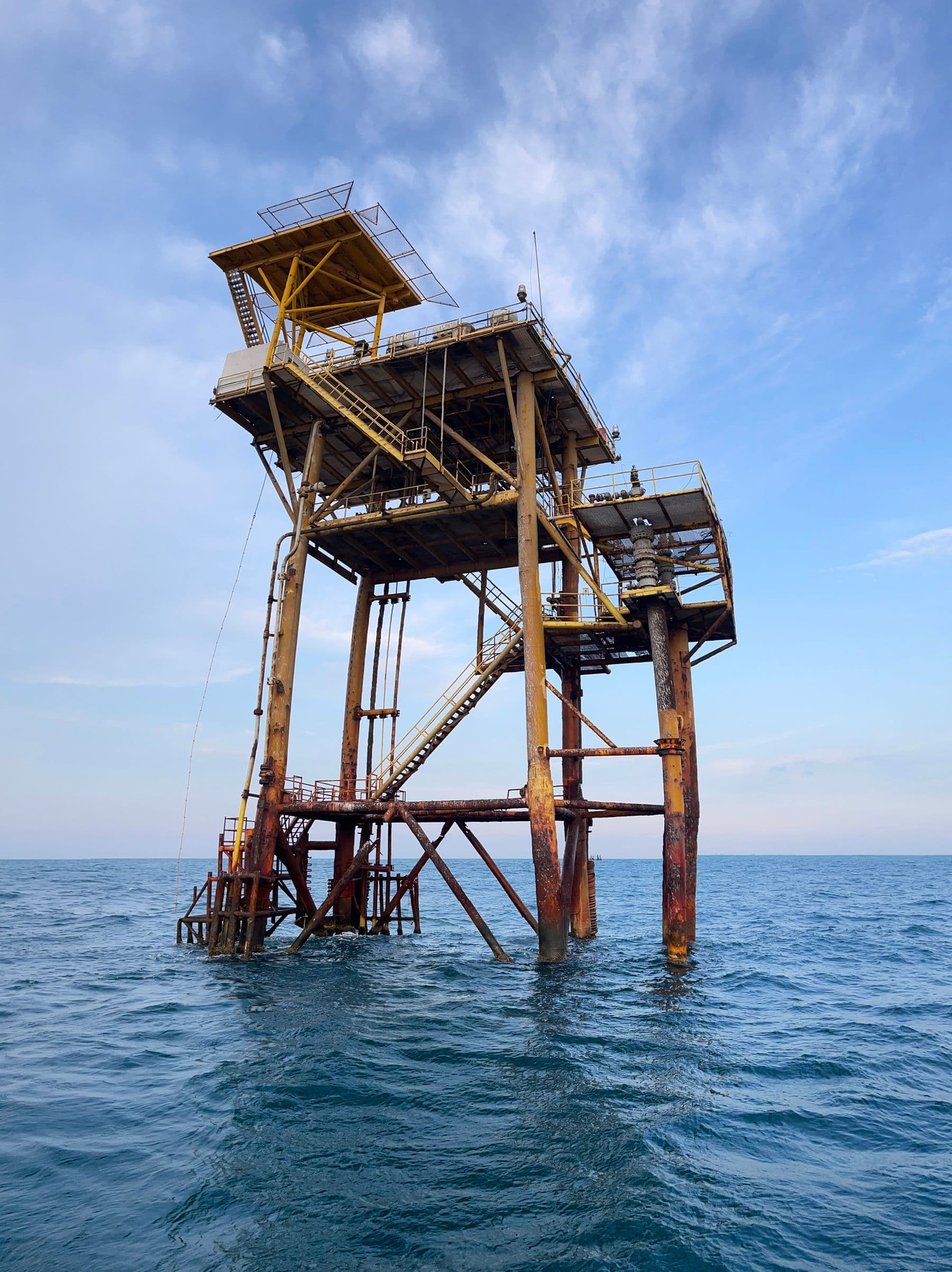 Fixed offshore production platform standing in open water