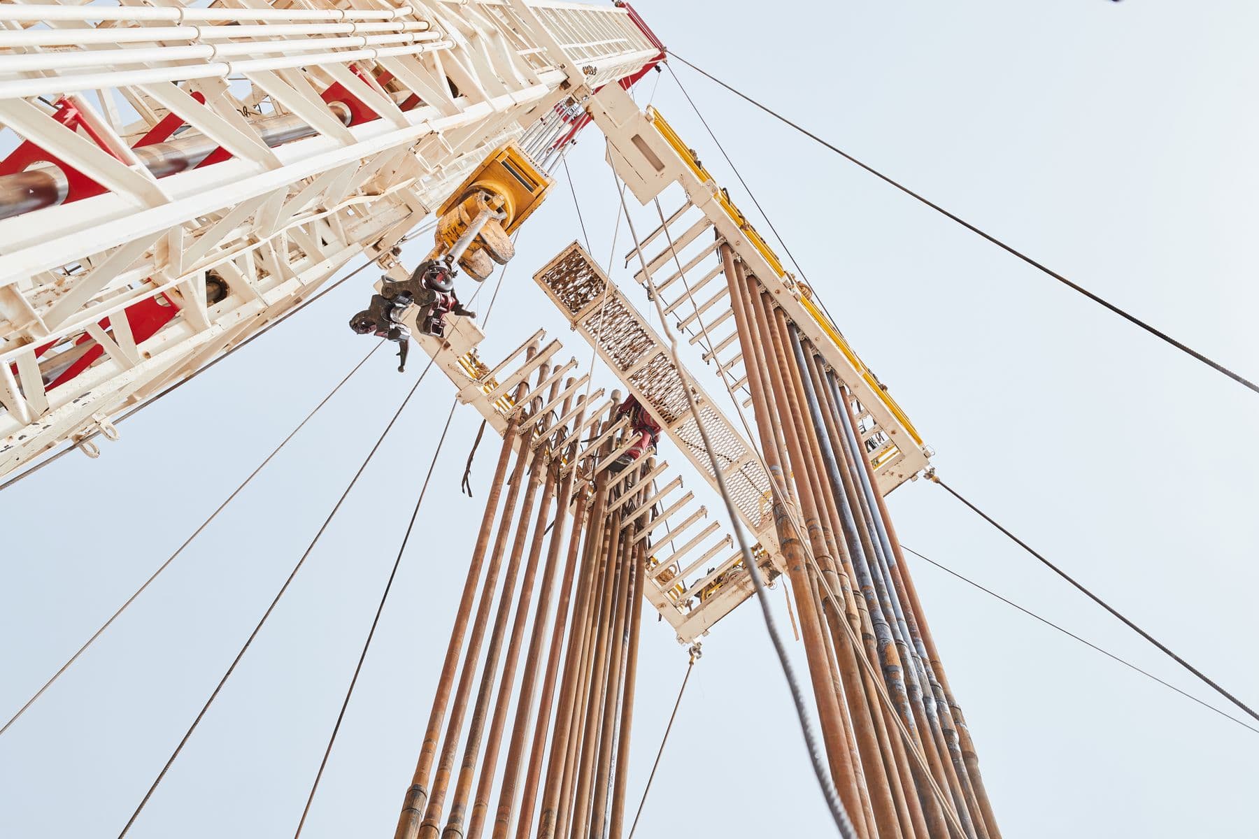 Low angle view of an oil rig structure against the sky